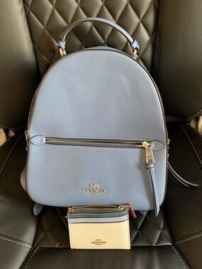Coach Pale Blue Leather Backpack with Gold Hardware and matching card case.